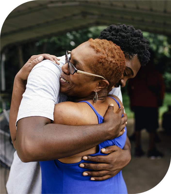 Mother and son sharing a warm hug